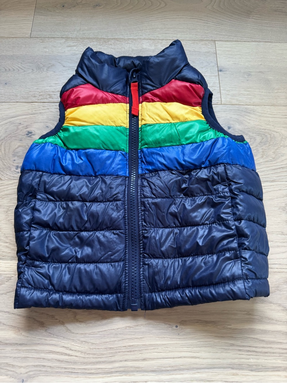 Primary Toddler Lightweight Puffer Vest Navy Bold Rainbow Stripe
